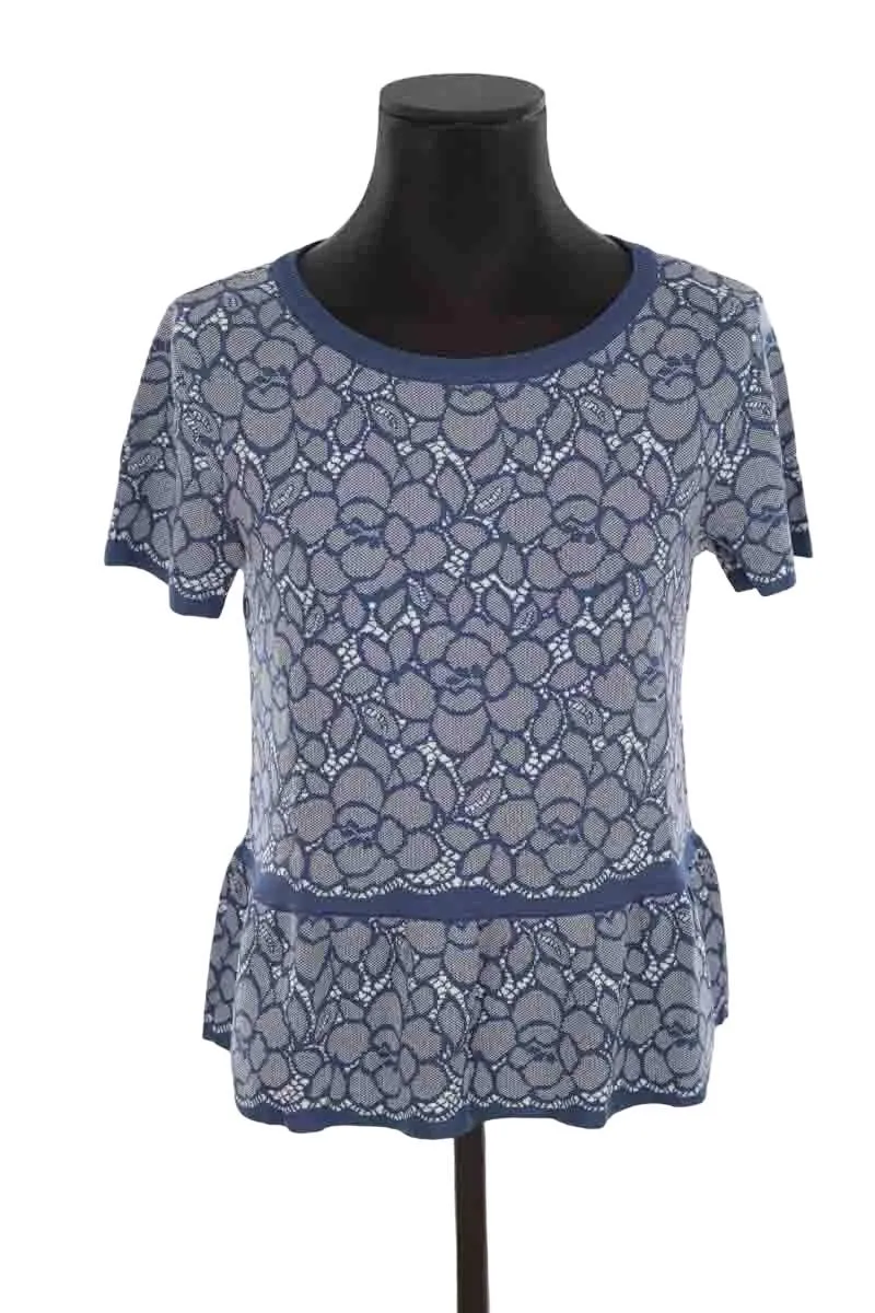 Top bleu  Moschino bleu. Matière principale polyamide. Taille 38.
